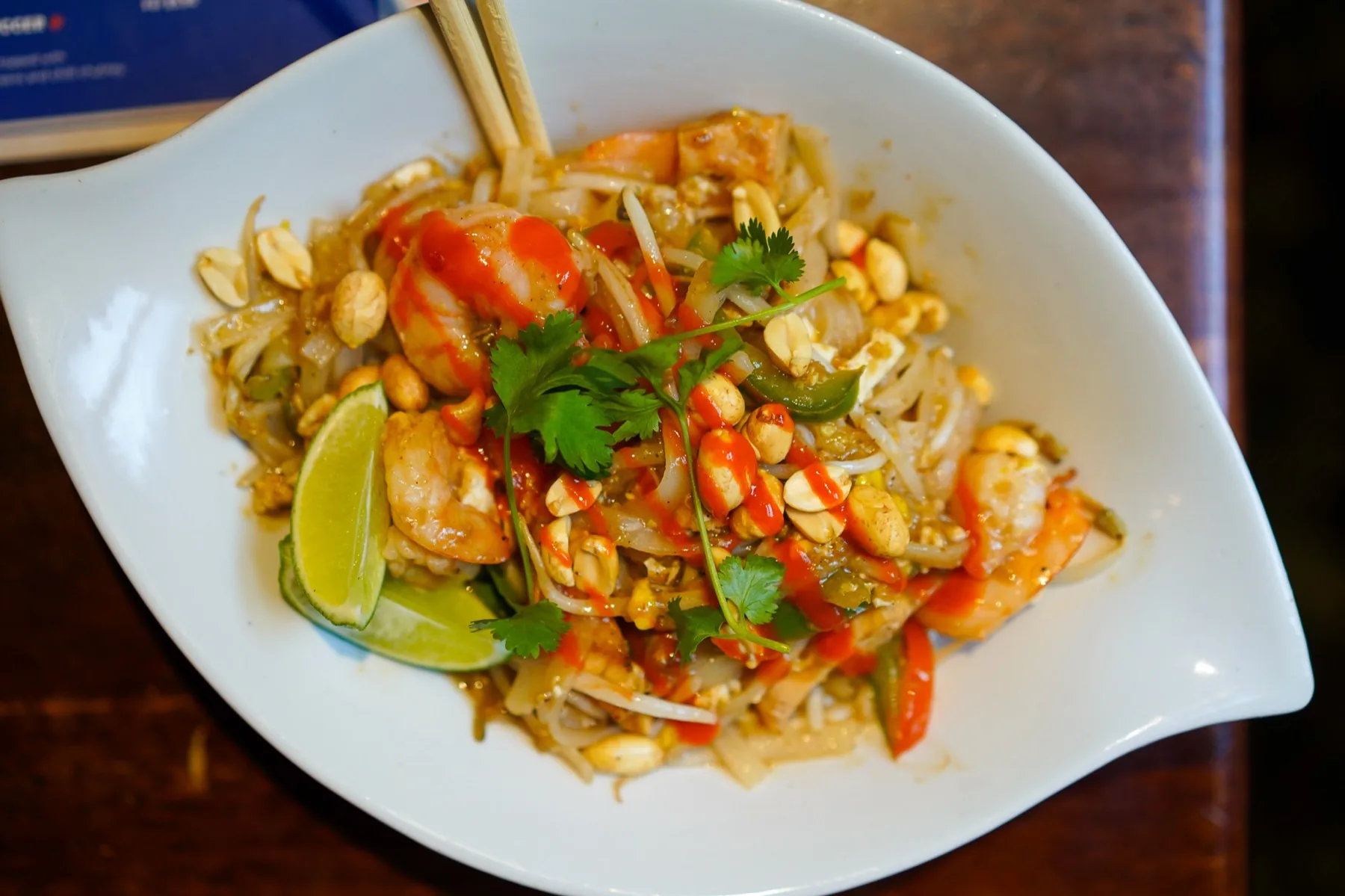 Shrimp pad Thai with peanuts, cilantro, and lime